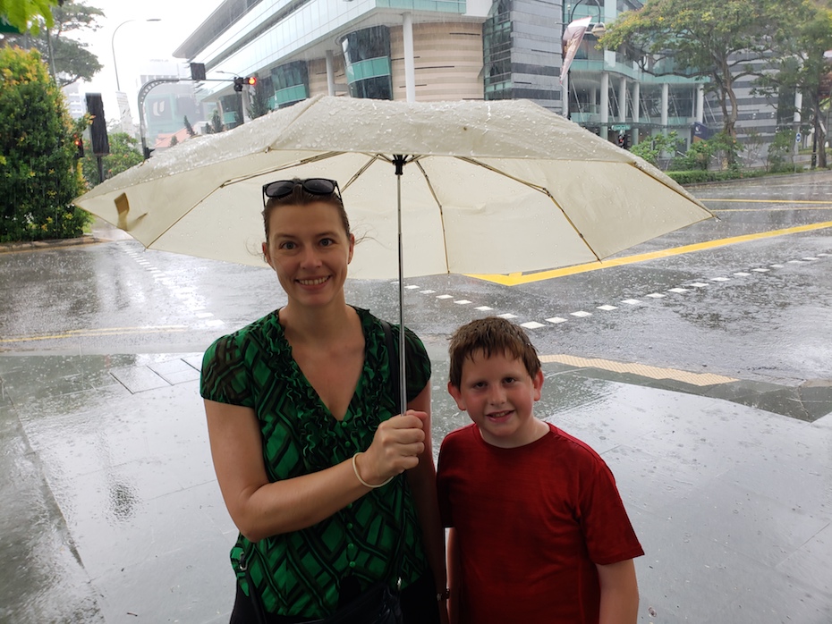Experiencing the cooling rain in Singapore.
