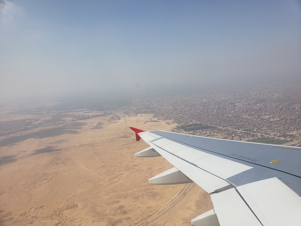 View of Giza Pyramids in Egypt from airplane.