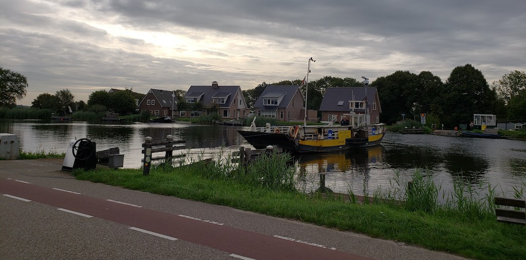 Ferry across a small river in the Netherlands: biking from Amsterdam to Gouda.