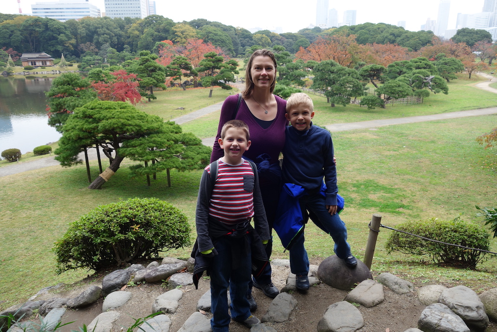 Mom and sons in a park in Tokyo.