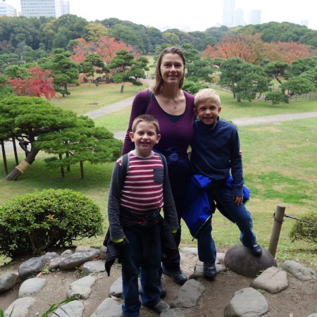 Mom and sons in a park in Tokyo.