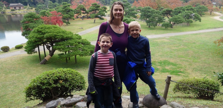 Mom and sons in a park in Tokyo.