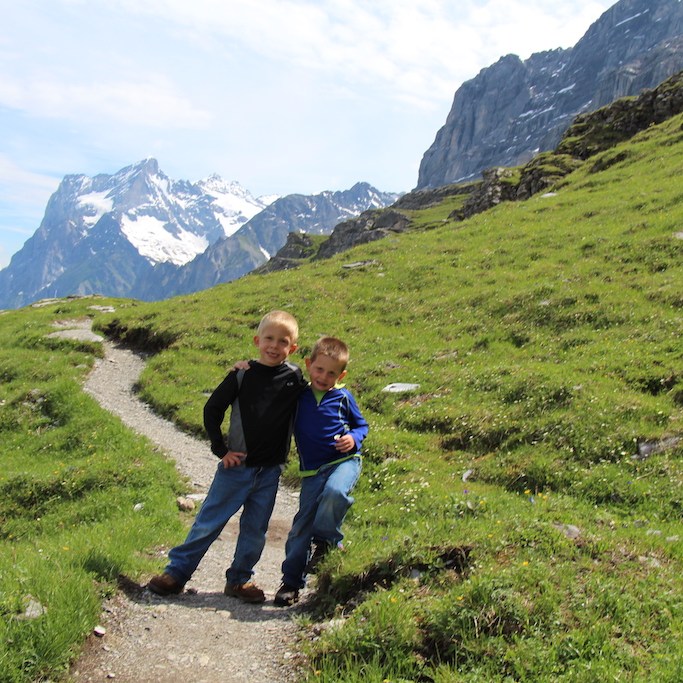 Boys hiking in the Jungfrau Region of Switzerland.