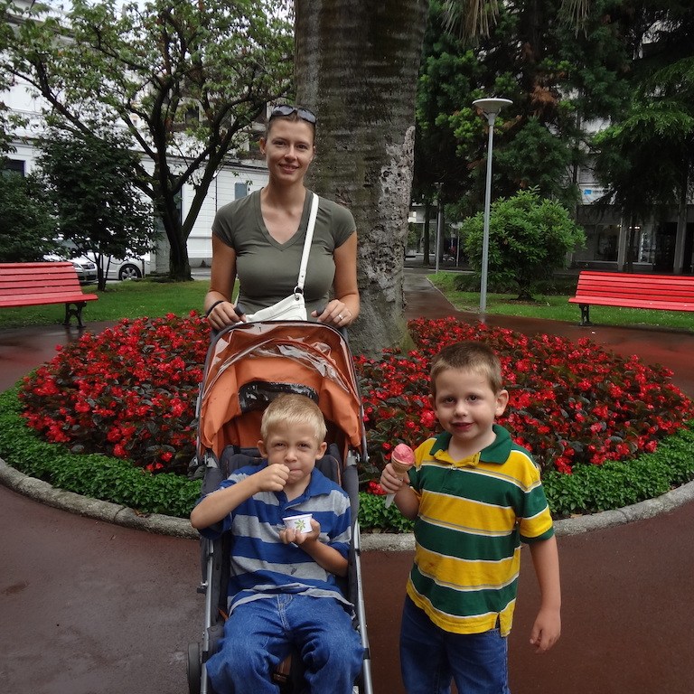 Mom and sons in a beautiful garden.