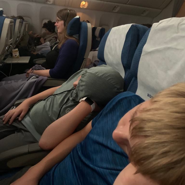 Sleeping on the airplane.