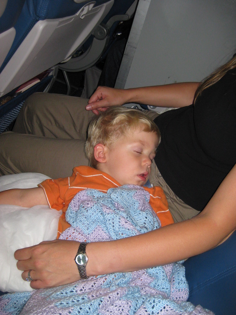 Child sleeping on an airplane.