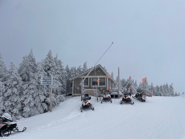 Cabin and snowmobiles at Okemo Mountain Resort in Vermont.