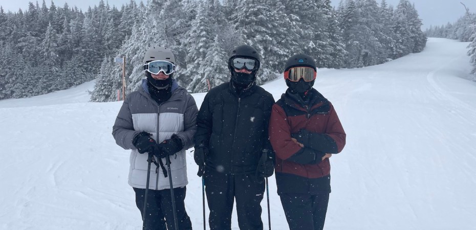 A mom and sons enjoying a day of skiing at Okemo Mountain Resort in Vermont.