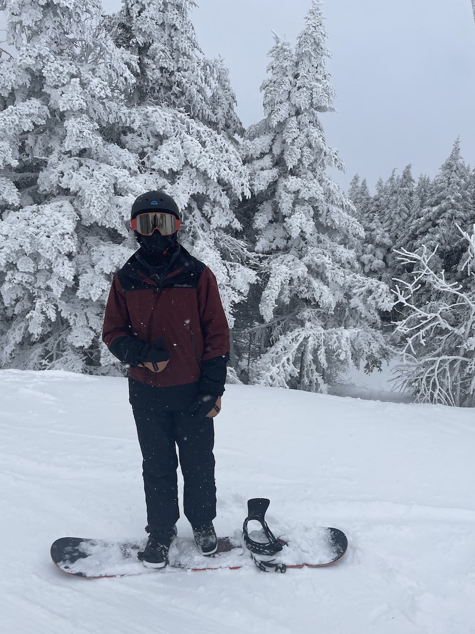 A boy getting ready to snowboard at Okemo Mountain Resort in Vermont.