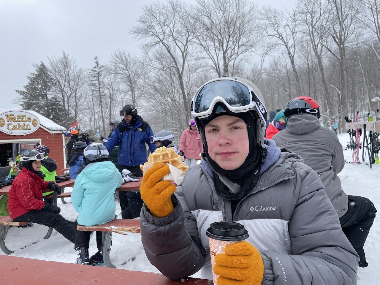 Enjoying a waffle and hot chocolate at the Waffle Cabin at Okemo Mountain Resort in Vermont.